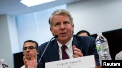 FILE - Manhattan District Attorney Cyrus R. Vance Jr., shown testifying at a hearing in New York in January 2014, says taking on cybercrime needs to be a worldwide endeavor.