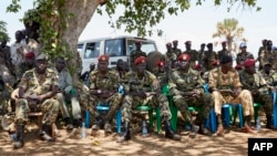 FILE - Members of the SSPDF special forces Tiger Batallion gather in Pageri, S. Sudan on Feb. 14, 2019. Members of SSPDF and their ex-rivals, SPLA-IO, gathered in Pageri to continue peace talks. 