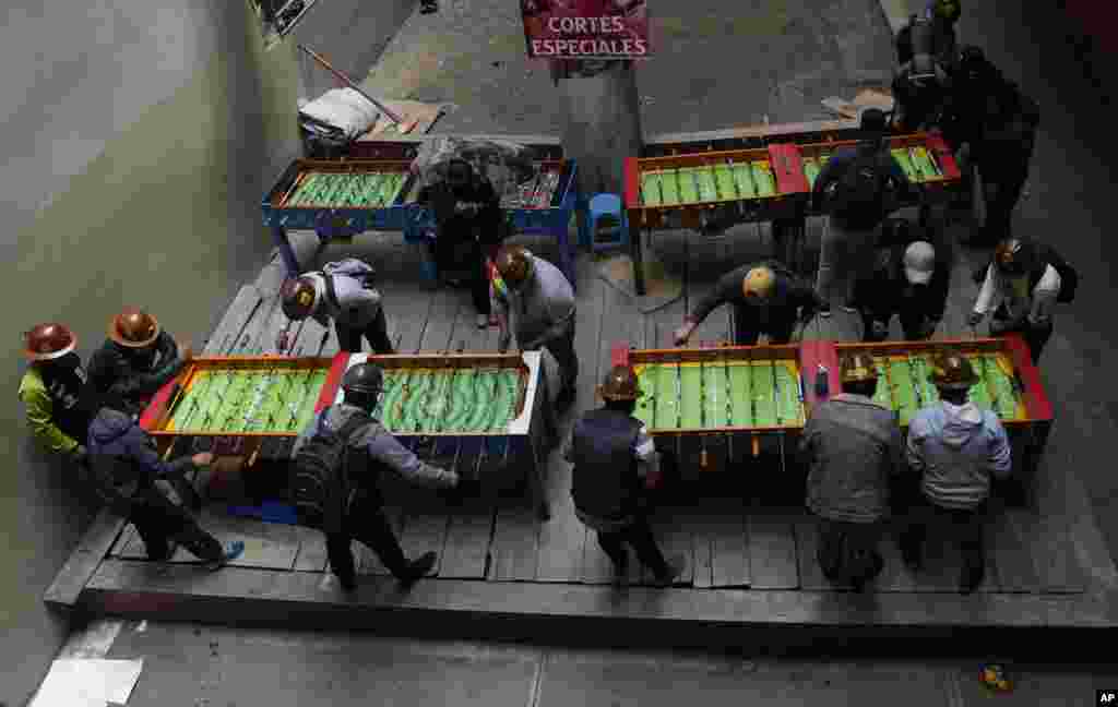 Striking independent miners play table football during a break in their protest against the government in La Paz, Bolivia, Thursday, Aug. 26, 2021. The miners continued their protests for the second day to demand the resignation of the country&#180;s mining mi