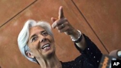 French Finance Minister Christine Lagarde gestures during a press conference at the French Embassy in Beijing, June 9, 2011.