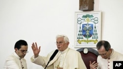 Pope Benedict XVI speaks to Catholic faithful at Notre Dame cathedral in Cotonou, Benin, Nov. 18, 2011.