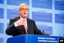 FILE - European Commission chief Jean-Claude Juncker is calling for an expanded country-by-country migrant quota plan throughout much of Europe, to accept thousands of asylum seekers from the Mideast over the next two years.