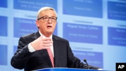 European Commission President-elect Jean-Claude Juncker addresses the media on the attribution of portfolios to the Commissioners-designate at the European Commission headquarters in Brussels, Sept. 10, 2014.