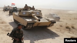 이라크 정부군이 18일 카이야라에서 모술을 향해 진격하고 있다.