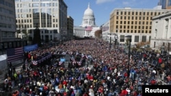U.S. President Barack Obama addresses thousands in Madison, Wisconsin, November 5, 2012, on his last day of campaigning.