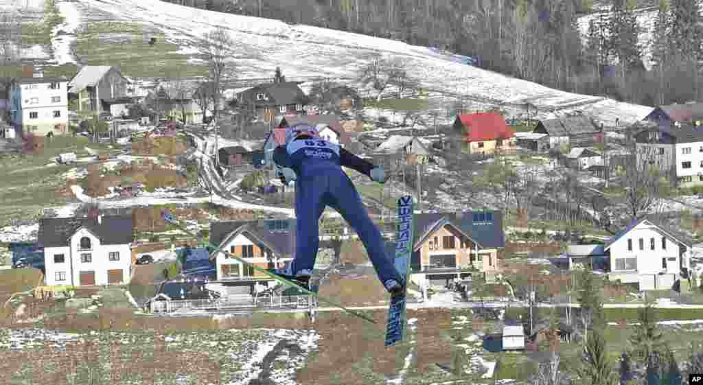 Germany&#39;s Severin Freund soars through the air during his trial jump at the 17th World Cup Ski Jumping competition in Wisla, Poland.