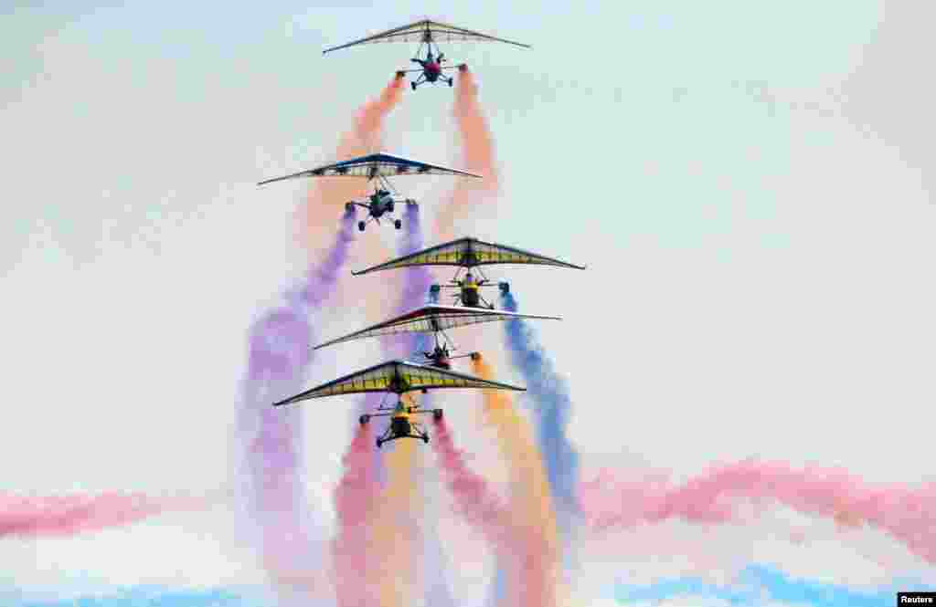 An aircraft team performs during an international general aviation show at the Yaocheng airport in Taiyuan, Shanxi province, China.