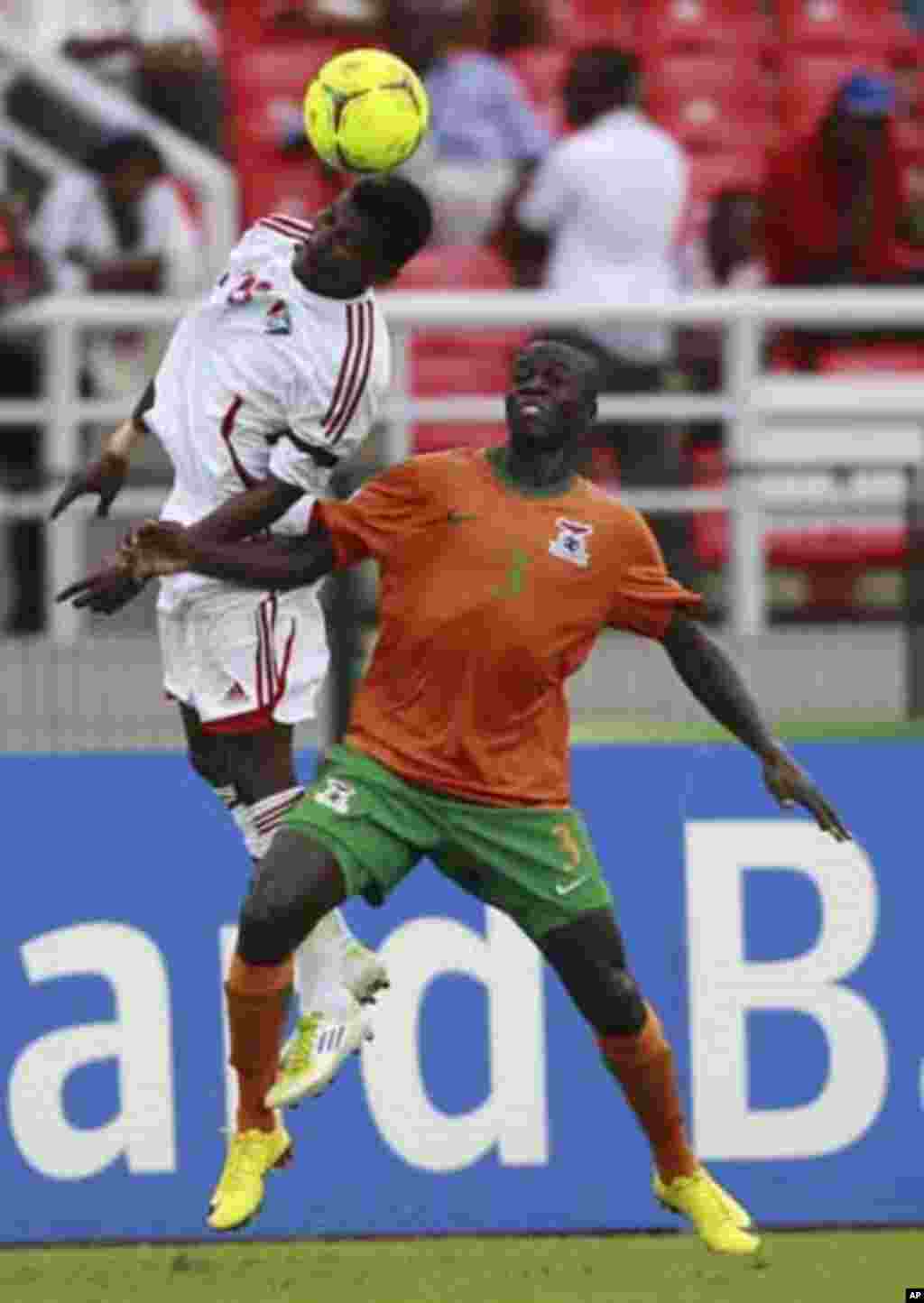 Chisamba Lungu of Zambia (R) fights for the ball with Khalefa Ahmed of Sudan during their African Nations Cup quarter-final soccer match at Estadio de Bata "Bata Stadium", in Bata February 4, 2012.