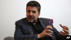 FILE - Rahmatullah Nabil, a former head of Afghanistan's secret service speaks during an interview in Kabul, Afghanistan.