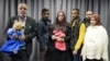 The families of missing British girls Amira Abase and Shamima Begum pose for a picture after being interviewed by the media in central London, Feb. 22, 2015. 