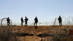 Israeli soldiers guard along a fence leading to the Israeli-occupied West Bank, as part of efforts to capture six Palestinian men who had escaped from Gilboa prison earlier this week, by the village of Muqeibila in northern Israel, Sept. 9, 2021.