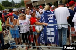 Supporters wait to see U.S. Republican presidential candidate Donald Trump speak at a campaign rally at the Sharonville Convention Center in Cincinnati, Ohio July 6, 2016.