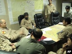 United State Air Force Major Micah West, left, is one of the American aviators helping to train Afghan pilots in the southern province of Kandahar, Aug 2010