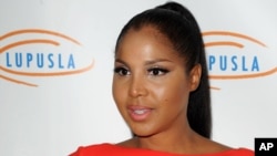 FILE - This Nov. 1, 2012 file photo shows singer and TV personality Toni Braxton at the Lupus LA's Hollywood Bag Ladies Luncheon in Beverly Hills, Calif. Braxton's autistic son makes his acting debut in her upcoming Lifetime movie "Twist of Faith." (Photo by Katy Winn/Invision/AP, file)