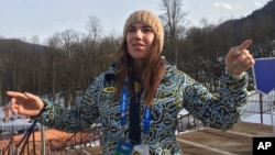 Ukrainian skier Bogdana Matsotska speaks during an interview with the Associated Press at the Sochi 2014 Winter Olympics, Feb. 20, 2014, in Krasnaya Polyana, Russia.