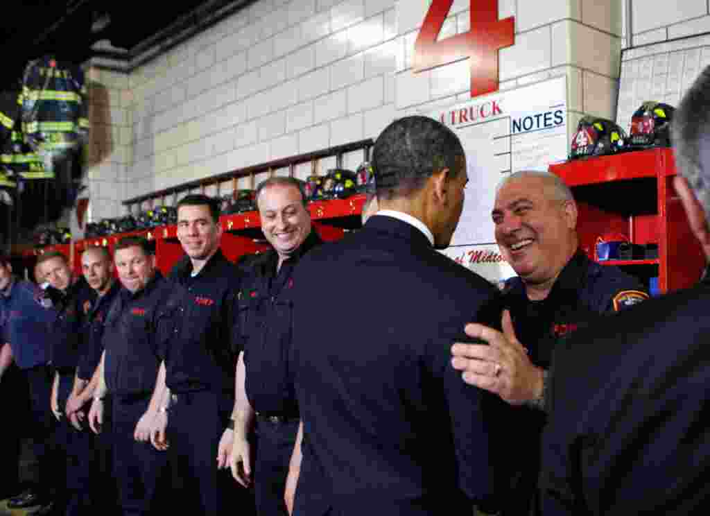 May 5: President Obama talks with fire-fighters at the Engine 54 Ladder 4 Fire Department firehouse in Times Square, during a visit to the World Trade Center site in New York City. (REUTERS/Kevin Lamarque)