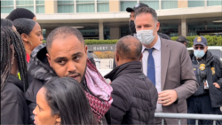 U.S. foreign service officer Geoffrey Parker meets with organizers of a protest against the Ethiopian government outside the State Department in Washington Nov. 4, 2021. (Sara Fissehaye/VOA)