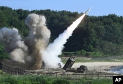 In this photo provided by South Korea Defense Ministry, a U.S. MGM-140 Army Tactical Missile is fired during the combined military exercise between the U.S. and South Korea against North Korea at an undisclosed location in South Korea, July 5, 2017.