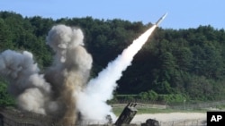 FILE - A U.S. MGM-140 Army Tactical Missile is fired during U.S.-South Korean exercises in South Korea, July 5, 2017. There's debate in the U.S. about whether the nation should consider redeploying tactical nuclear weapons to the Indo-Pacific. (South Korea Defense Ministry)