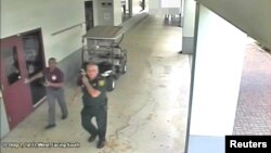 Then-Broward County Sheriff's Deputy Scot Peterson, who was assigned to Marjory Stoneman Douglas High School during the Feb. 14, 2018, shooting, is seen in this still image captured from the school surveillance video released by Broward County Sheriff's Office in Florida, March 15, 2018. 