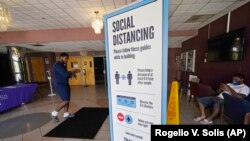 In this July 27, 2021 file photo, social distancing as well as face covering is recommended at the COVID-19 vaccination site in the Rose E. McCoy Auditorium on the Jackson State University campus in Jackson, Miss. (AP Photo/Rogelio V. Solis, File)