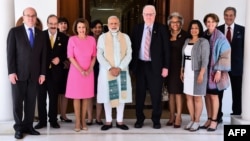 A U.S. congressional delegation, including Reps. Nancy Pelosi, center left, Jim McGovern, left, and Jim Sensenbrenner, center right, pose ahead of a meeting in New Delhi with India's Prime Minister Narendra Modi, center, in this handout photo from the Indian Press Information Bureau, May 11, 2017.