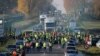 People wearing yellow vests, a symbol of a French drivers' nationwide protest against higher fuel prices, block the Paris-Brussels motorway in Haulchin, France, Nov. 17, 2018. 