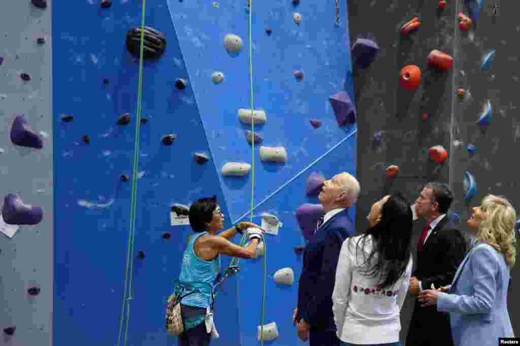 U.S. President Joe Biden and first lady Jill Biden meet with Virginia Governor Ralph Northam to discuss the state&#39;s progress against the coronavirus pandemic at Sportrock Climbing Centers in Alexandria, Virginia.