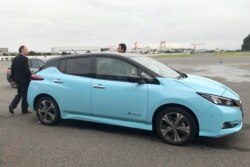 FILE -Nissan's electric vehicle with new 'all-wheel-control' technology is ready for a demonstration to reporters at its Oppama test driving course in Yokosuka, near Tokyo, Oct. 18, 2019.