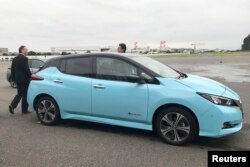 FILE -Nissan's electric vehicle with new 'all-wheel-control' technology is ready for a demonstration to reporters at its Oppama test driving course in Yokosuka, near Tokyo, Oct. 18, 2019.
