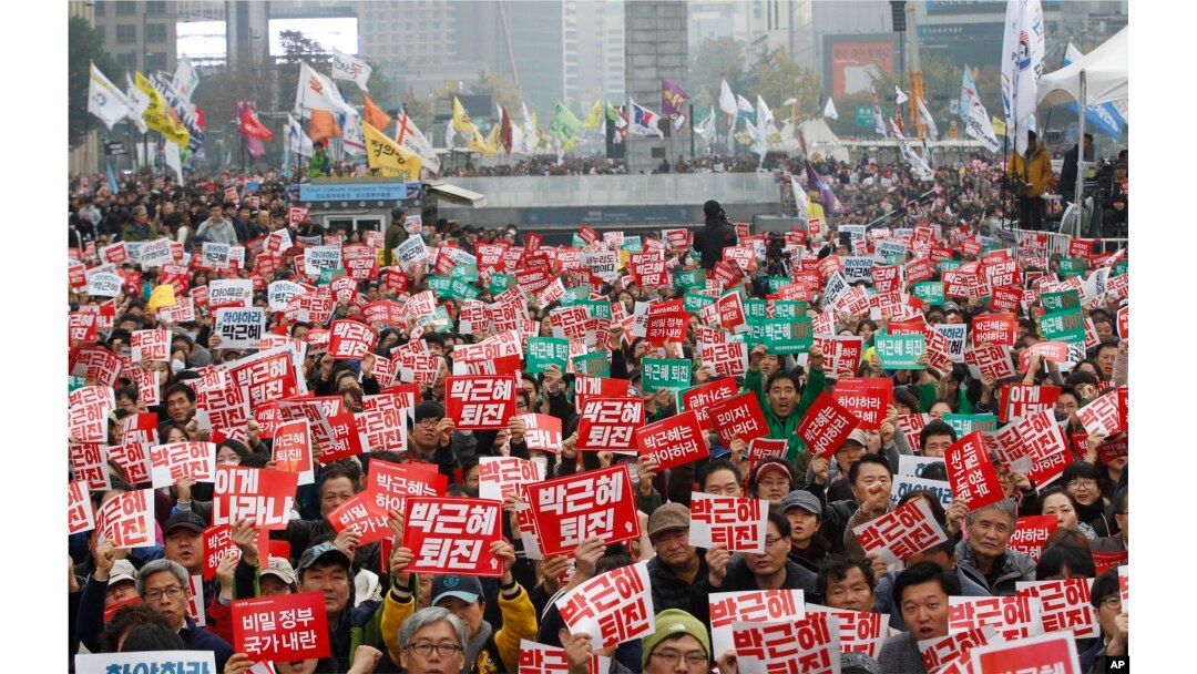 South Korean protesters stage a rally calling for South Korean President Park Geun-hye to step down in downtown Seoul, South Korea, Saturday, Nov. 5, 2016.