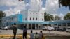 Patients wait outside the Santo Socorro Hospital to be treated from COVID-19 in Santo Domingo, on May 19, 2021.