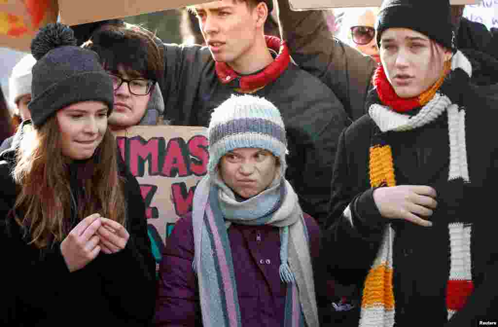 Swedish climate change activist Greta Thunberg, center, takes part in a climate strike protest during the 50th World Economic Forum annual meeting in Davos, Switzerland.