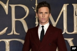 Actor Eddie Redmayne poses for photographers on arrival at the premiere of the film 'Fantastic Beasts: The Crimes of Grindelwald', in London, Nov. 13, 2018.