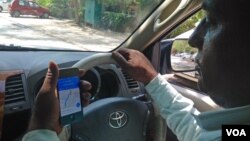 India's new proposed bill on geospatial services could affect taxi drivers and others using maps on their mobiles to guide them to their destination. (A. Pasricha/VOA)