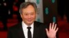 Director Ang Lee poses as he arrives for the British Academy of Film and Arts awards ceremony at the Royal Opera House in London, Feb. 10, 2013.