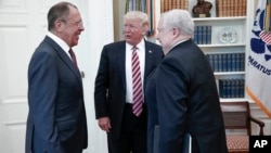 FILE - U.S. President Donald Trump meets with Russian Foreign Minister Sergey Lavrov, left, next to Russian Ambassador to the U.S. Sergei Kislyak at the White House in Washington, May 10, 2017. (Russian Foreign Ministry photo via AP) 