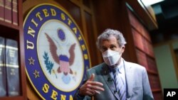 Sen. Sherrod Brown, D-Ohio, speaks to reporters at the Capitol on September 23, 2021 in Washington.
