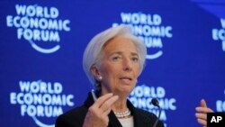 FILE - Christine Lagarde, managing director of the IMF, attends a session on the Economic Outlook on the fourth day of the annual meeting of the World Economic Forum in Davos, Switzerland, Jan. 20, 2017.