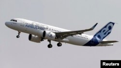 FILE - Normal rate of ascent for commercial jets like the Airbus A320 pictured is 300 to 600 meters per minute, an Indonesian official says; AirAsia Flight QZ8501, which crashed Dec. 28, was climbing about 1,800 meters per minute.