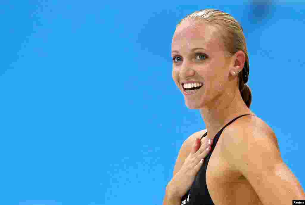 Dana Vollmer of the U.S. reacts after winning the women's 100m butterfly final during the London 2012 Olympic Games at the Aquatics Centre July 29, 2012. Vollmer set a world record with a timing of 55.98 seconds.