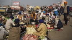 Protesting farmers prepare a meal for fellow farmers as they block a major highway during a protest at the Delhi-Haryana state border, India, Dec. 1, 2020.