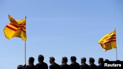 FILE - The flag of former South Vietnam is seen as visiting officals of the Vietnamese community attend a ceremony on the flight deck of the USS Midway.