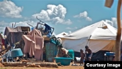 A pile of personal property left in the open at the Chingwizi transit camp. Hundreds of families lost their property during their relocation to the camp. (Photo: Human Rights Watch)
