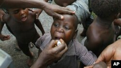 Child receiving polio vaccination (2004 photo)