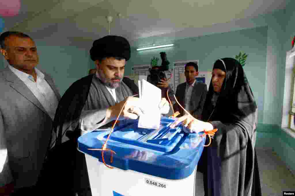 Shiite cleric Moqtada al-Sadr casts his vote at a polling station during parliamentary election in Najaf, south of Baghdad April 30, 2014. Iraqis head to the polls on Wednesday in their first national election since U.S. forces withdrew from Iraq in 2011 