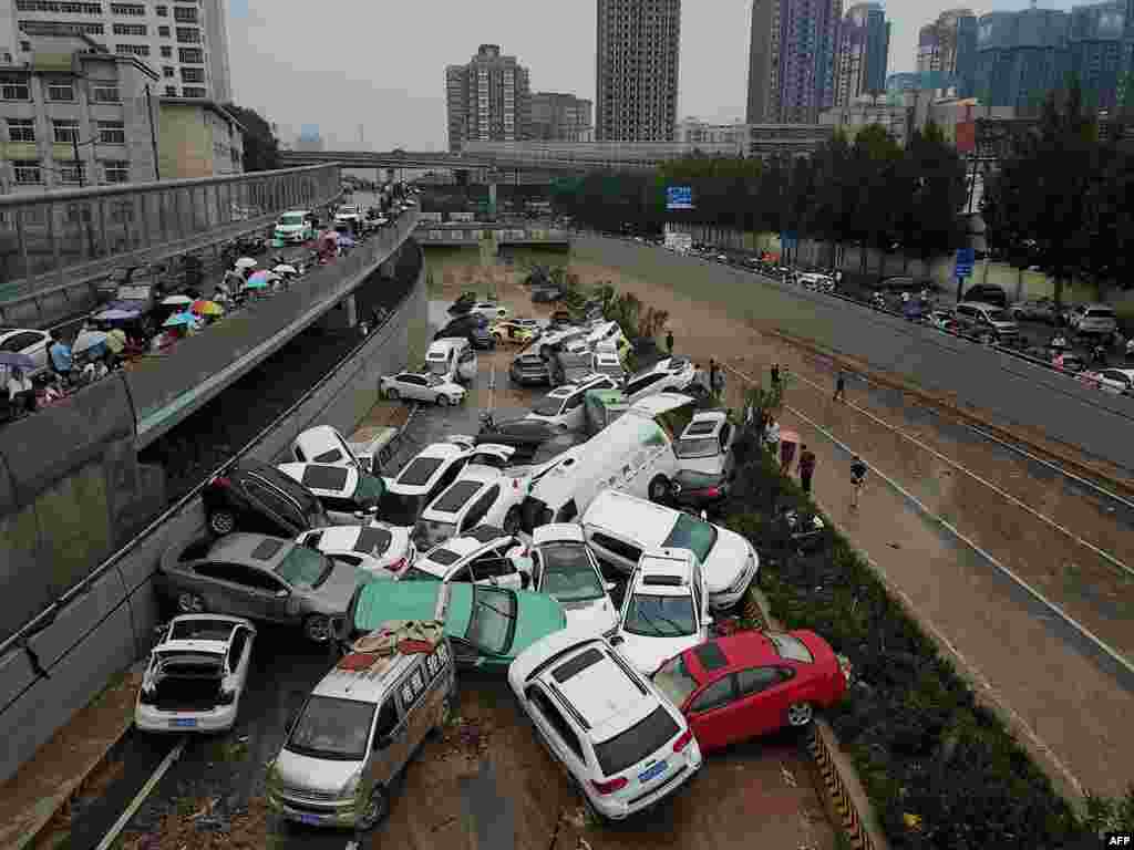 This image from above shows cars sitting in floodwaters at the start of a tunnel after heavy rains hit the city of Zhengzhou in China&#39;s central Henan province.