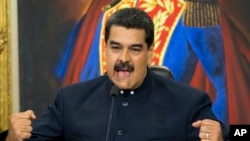 FILE - Venezuela's President Nicolas Maduro speaks during a press conference at the Miraflores presidential palace, in Caracas, Venezuela, Oct. 17, 2017. 