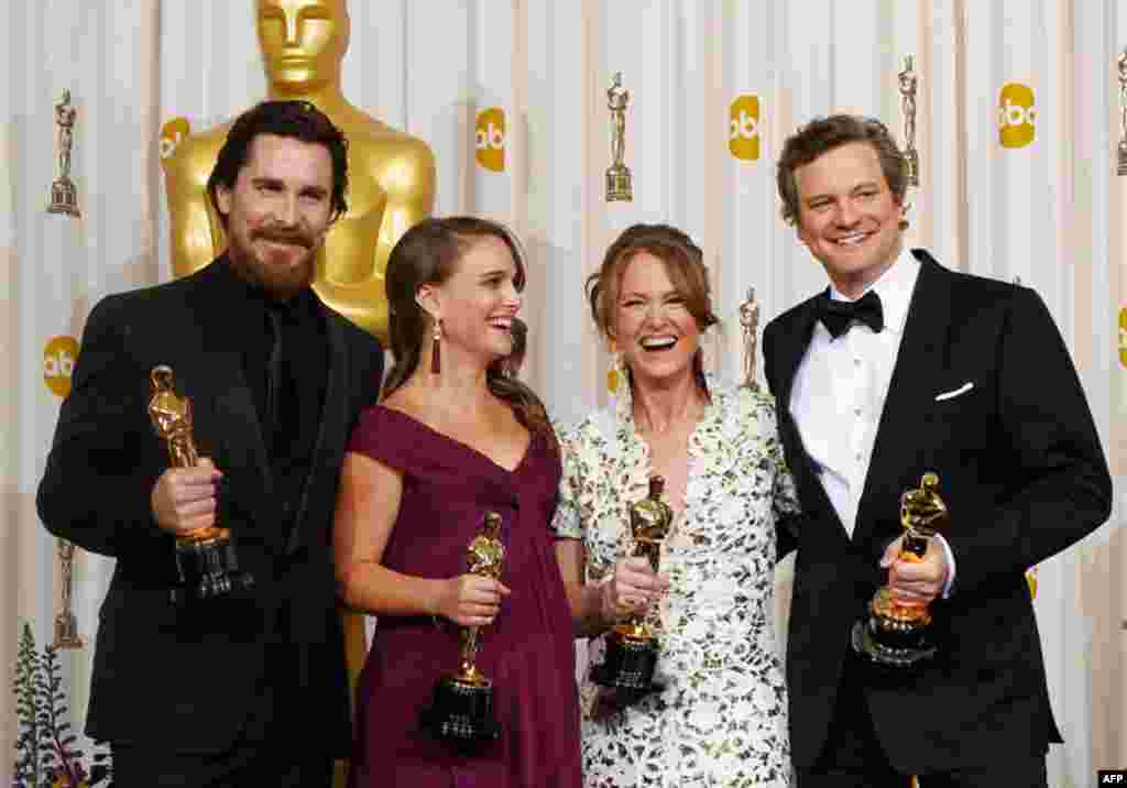 (L-R) Oscar winners for best supporting actor Christian Bale, best actress Natalie Portman, best supporting actress Melissa Leo, and best actor Colin Firth backstage at the 83rd Academy Awards. (Reuters/Mike Blake)