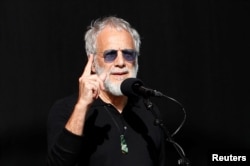 Yusof Islam, formerly known as Cat Stevens, performs at the national remembrance service for victims of the mosque attacks, at Hagley Park in Christchurch, New Zealand, March 29, 2019.